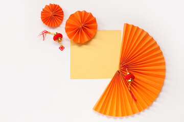 Blank card with fans and lanterns on white background. Chinese New Year celebration