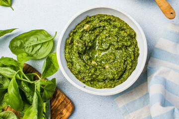 Pesto sauce and ingredients on white background, copy space.Food frame italian food background healthy food concept or ingredients for cooking pesto sauce on a vintage background top view with copy sp