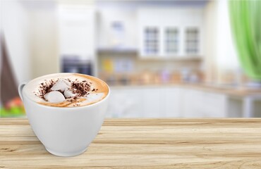 Tasty hot coffee cappuccino with milk in cup