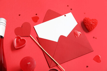 Paper heart with candles and envelope on red background. Valentine's Day celebration
