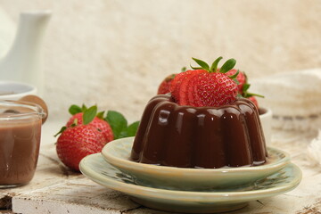 Chocolate pudding or puding coklat with strawberry,delicious sweet dessert on white background	