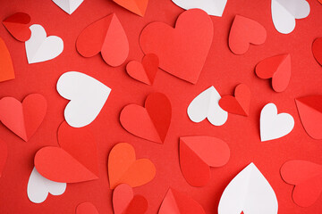 Beautiful composition with paper hearts on red background. Valentine's Day celebration