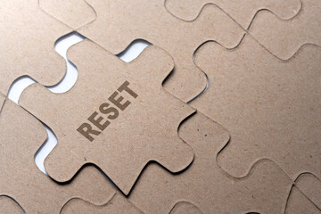 Piece of missing jigsaw puzzle with Reset text