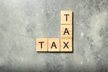 Wooden cubes with TAX letters