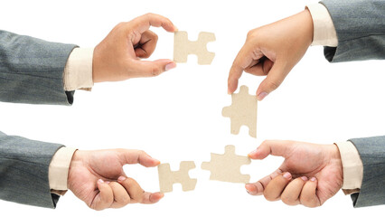 Collection of business hand holding a single piece of puzzle