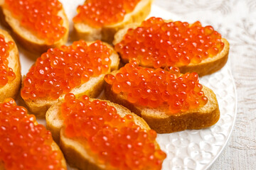 Sandwiches with red caviar. New Year's table. 