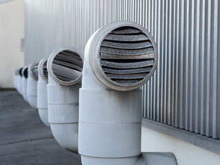 Ventilation pipes are installed on the factory roof.