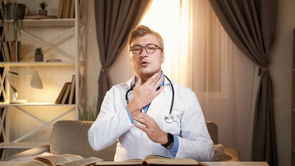Doctor expertise. Online consultation. Smart medical professional man explaining examining neck...