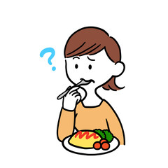 オムライスを食べて不思議そうな表情を浮かべる女性