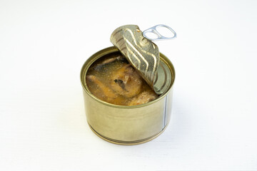 Unlabeled canned tuna on white background. blank mockup tin-coated steel tuna can with open lid on white table. Canned fish steak and preserved food concept. white background.