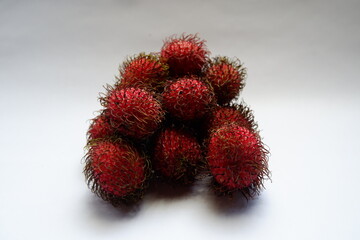 Rambutan (Nephelium lappaceum) isolates in white background, asian fruit with sweet and sour taste