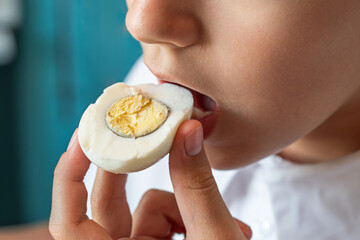 Health care, loss weight people concept. girl eating tasty egg, close up mouth