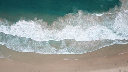 Fototapeta na wymiar Top down aerial view of sandy tropical beach in summer in Eastern Australia, Queensland, Surfers Paradise, Gold Coast