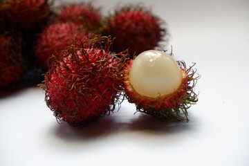 Rambutan (Nephelium lappaceum) isolates in white background, asian fruit with sweet and sour taste