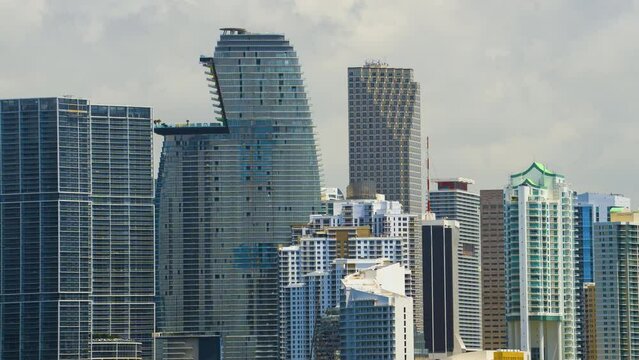 Concrete and glass skyscraper buildings in downtown district of Miami Brickell in Florida, USA. Waterfront American megapolis with business financial district on sunny day