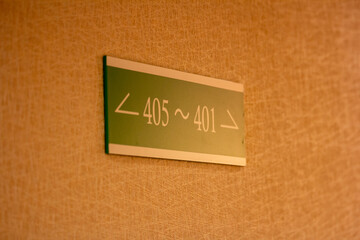 Tokyo, Japan, 30 October 2023 : Room number sign in hotel corridor.