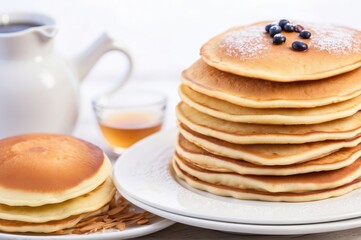 Plate of delicious pancakes with fresh blueberries