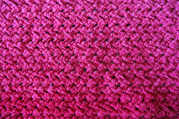 Close-Up of an Intricately Textured Pink Crocheted Blanket