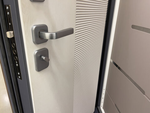 Modern door with lock and handle. Close-up view.