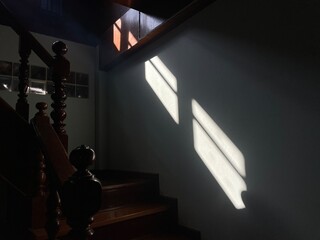 Shadow from the sunlight shining through the window.
Inside the house, entrance to the 2nd floor