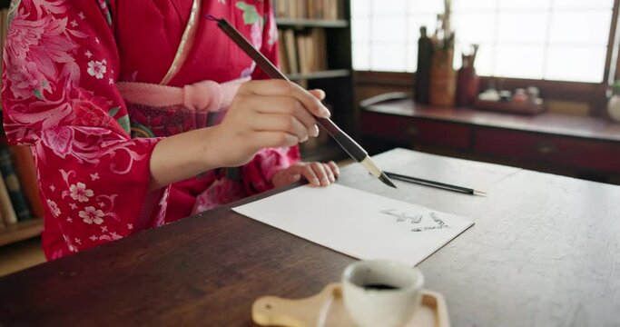 Paintbrush, ink and hands, Asian font or script with paper, document and creativity, calligraphy and traditional text. Japanese writing, writer with drawing paint and person at desk with art tools