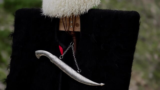 Close-up of a sheep and dagger hat with silver color.
