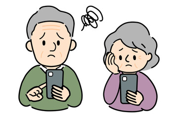 スマホを見て困っているシニアの男女