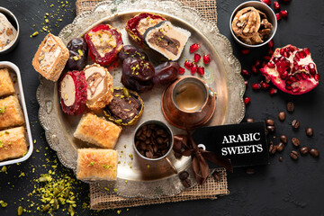 Hot tasty coffee with various pieces of turkish delight desets on a dark background. Traditional arabian food