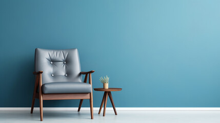 Modern blue armchair. Blue wall with copy space.