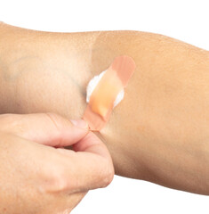 Adhesive plaster with cotton wool after an injection on the arm