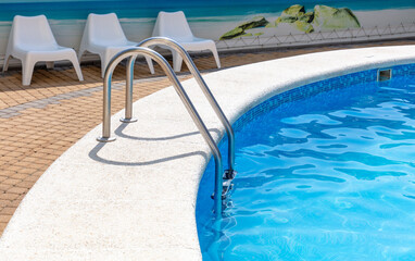 Metal staircase to the pool