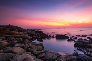 Beautiful scenery of sunset and rocks at Lan Hin Khao Beach in Rayong province, Thailand