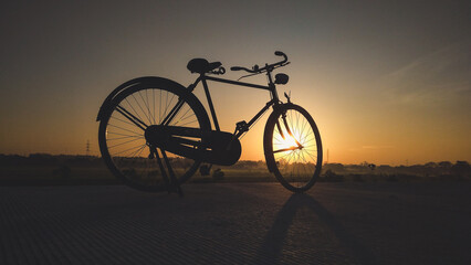 Fototapeta premium An old bicycle photographed at sunrise.
