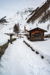 Church of Santo Spirito immersed in the snow of Val Aurina