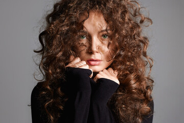 beautiful young woman with curly hair. beauty portrait of hair girl - 705491706