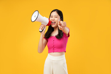 Photo of a young Asian woman wearing a pink t-shirt, holding a megaphone pointing forward, join us,...