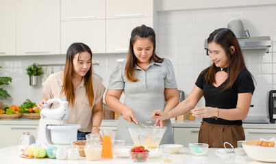 Asian cheerful professional female pastry bakery baker chef housewife with friend standing smiling...