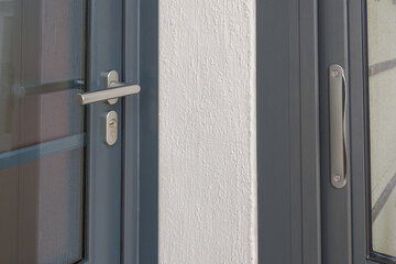 door handle silver aluminum entrance grey and window gray in house facade