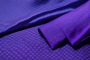 A patterned silk tie paired with a lavender dress shirt.