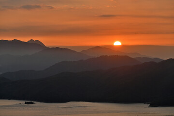 The sunset sink into mountains