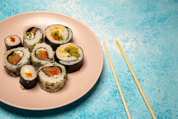 sushi on a pink plate