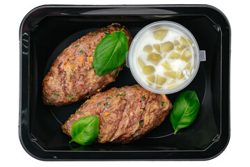 beef patty with side dish in lunch box on white background