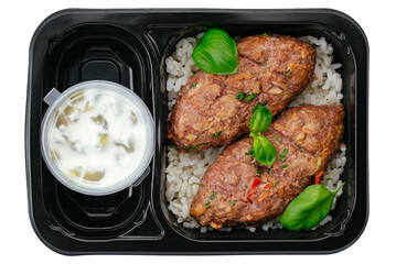 beef patty with side dish in lunch box on white background