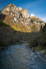 River and sunlight mountains in Val di Mello, Italy