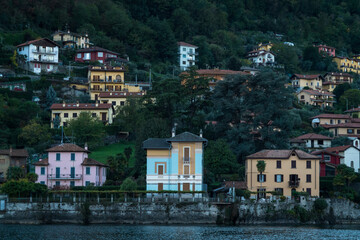 Fototapeta na wymiar Multicolored houses along Lake Como, Italy