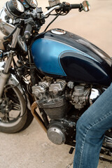 close up view of vintage blue motorcycle and chrome engine