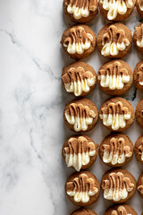 Coco Powdered and frosted Eclair Choux