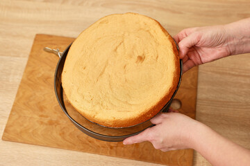 The freshly baked cake is removed from the mold. Cooking a festive pie at home