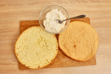 Adding the filling to the cake. Cooking a festive pie at home