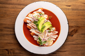 Mexican red enchiladas. Aerial view of Mexican food